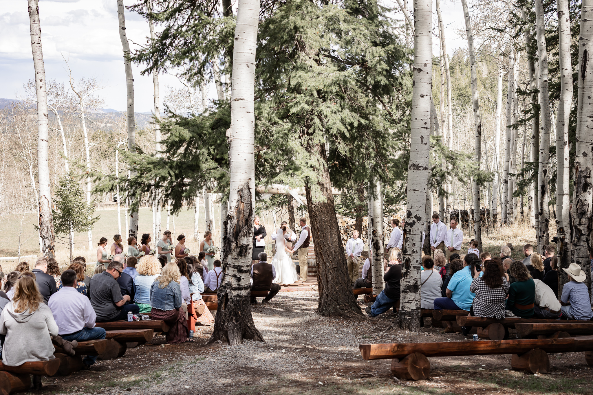 Deer Creek Mountain Camp wedding venue in Bailey Colorado | Dahli Floral | Cottage Creations Custom Confections 
 Elite Beauty Co | Magnifica Bella | Mountain wedding venue